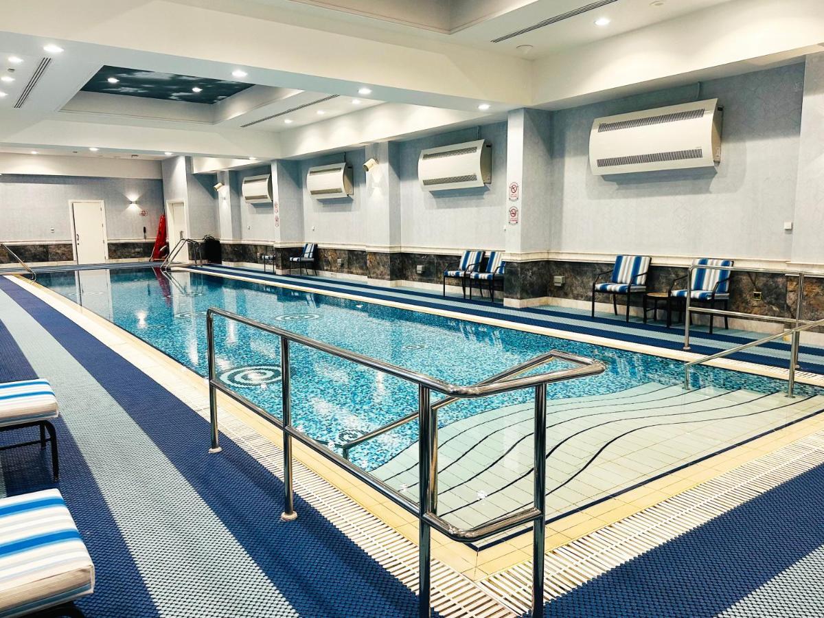 Al Aziziyah Boutique Hotel By The Torch Al Rayyan Exterior photo Swimming pool at the hotel