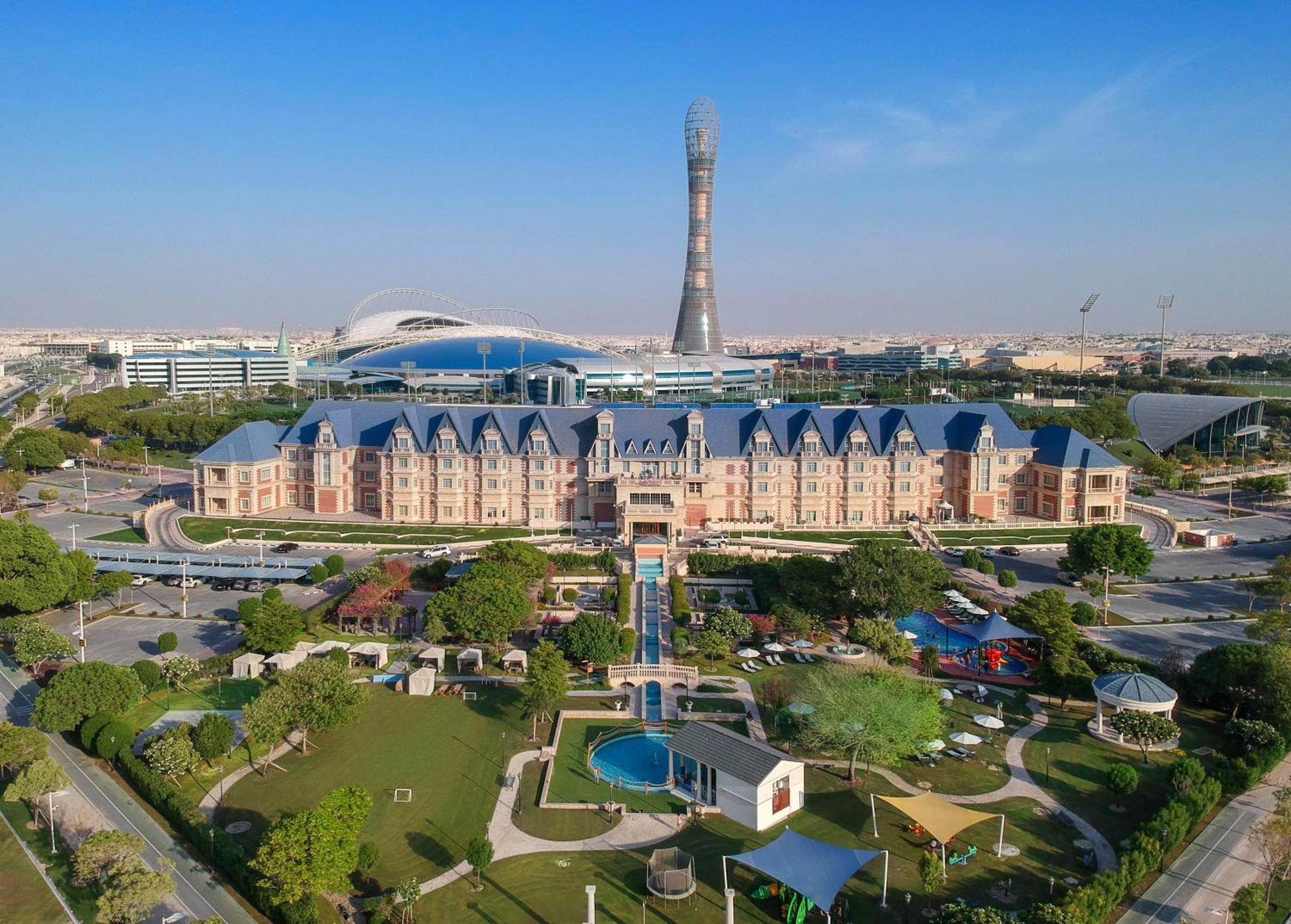 Al Aziziyah Boutique Hotel By The Torch Al Rayyan Exterior photo Aerial view of the Al-Shaab Olympic Village